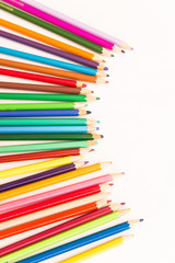 multi-colored pencils for drawing children in school and kindergartens on a white background