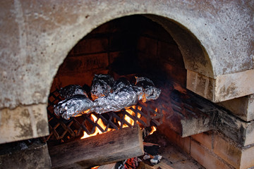 Making baked sweet potato in kiln