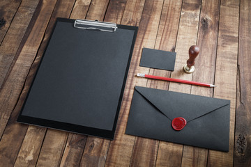 Blank black stationery set on vintage wooden background. Mock up for branding identity. ID template.