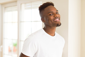 Handsome african young man smiling cheerful with a big smile on face