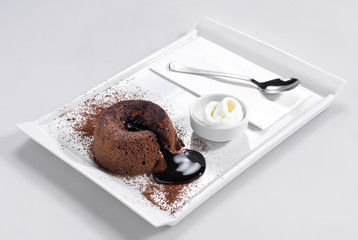 Chocolate filled cake with vanilla ice cream.