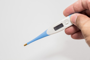 Hand holding the thermometer on white screen isolated