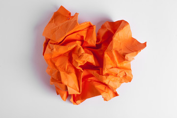 Composition of crumpled sheet of paper placed on a white background