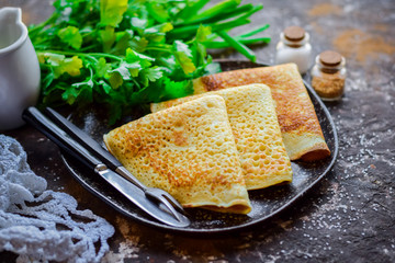 Lush pancakes with parsley and melted butter.