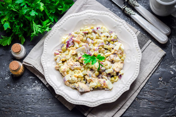 Salad of smoked chicken breast, red onions, green peas, eggs for mayonnaise.