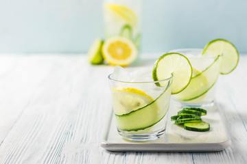 Refreshing summer drinks, iced cucumber lime cocktail. Selective focus, space for text.