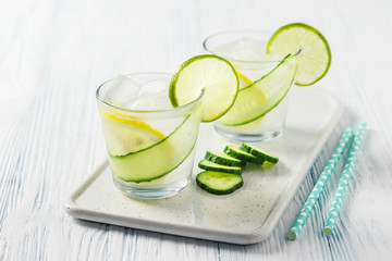 Cucumber infused lime iced water. Selective focus, space for text.