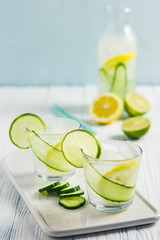Refreshing summer drinks, iced cucumber lime cocktail. Selective focus, space for text.