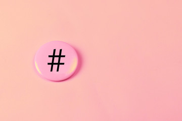 Hashtag sign on iron badge