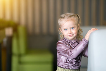 Girl 4-5 years old with white hair braids with blue eyes.
