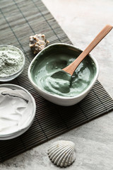 Bowls with cosmetic clays on light table