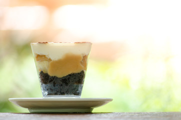 delicious cake  on table in the garden background, break time.