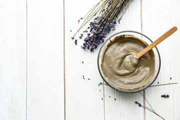 Cosmetic clay on white wooden table