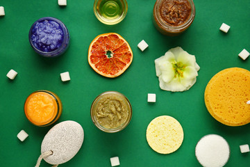 Different sugar scrubs on color background