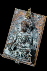 Thailand amulet on black background , The old material texture.