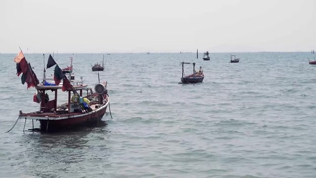 Fishing boats float in the sea after catching fish