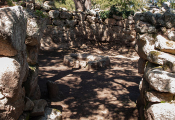 Sacred Source entrance archaeological site of Noddule in the megalithic circle and large circular hut in the new archaeological site in Nuoro Sardinia , ITALY.
