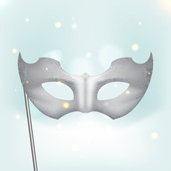 Silver carnival mask with feathers.