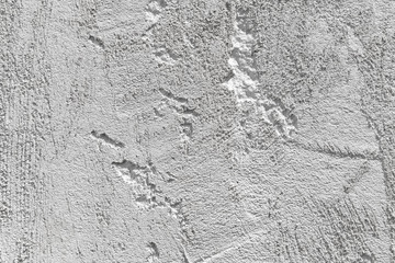 Gray concrete wall with faded stucco