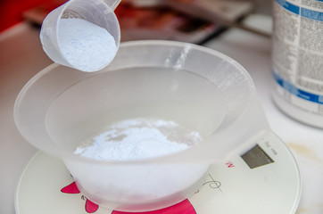 Hairdressing set measuring bowl on scales