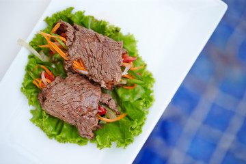 Rolled grilled beef with vegetables
