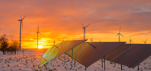 solar panels and wind turbines working in winter