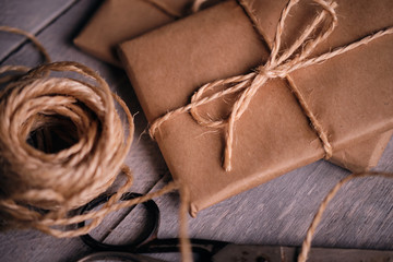 Gift packages of kraft paper, rope and scissors