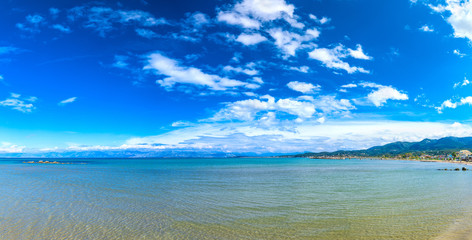 Beautiful summer panoramic seascape.  Green slopes in close bays with crystal clear azure water. Coastline of north part Corfu island, Ionian archipelago, Sidari, Greece.
