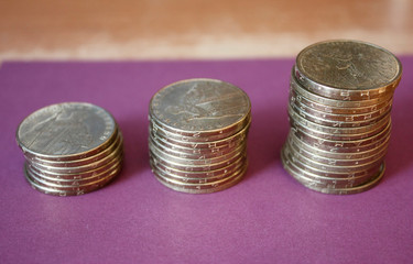 stacks of coins from the Ukrainian bank. Coins of Ukrainian type: Kopek. Concept of banking, taxes, debt, with a blurred background.