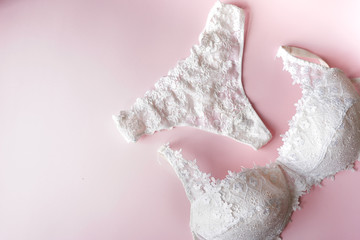 elegant pentie and bra , women underwear on pink background. Copy space. Beauty blogger concept. Romantic lingerie for Valentine's day temptation. fashion concept.