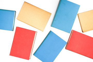 Colorful books on white backgroundnotebook, pencil, brush, , working, business, office, isolated, desk, white, monitor, screen, desktop, table, work, communication, equipment, blank, black, phone, nob