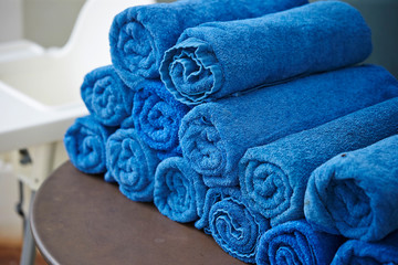 Blue rolled gym towel on table 