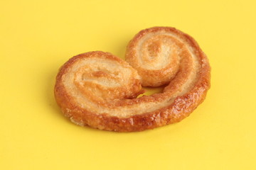 Puff pastry cookies on colorful background