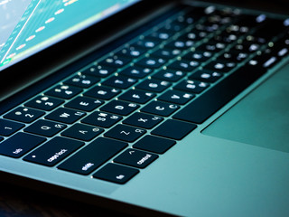 Black laptop keyboard with backlit, close up