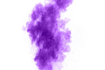 Purple color powder explosion cloud  on white background.Closeup of purple dust particles splash on background.