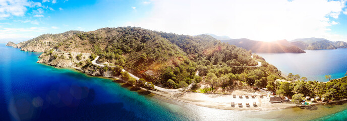 panoramic over a secluded beach with turquoise waters and bright blue sky, Oludeniz, Turkey