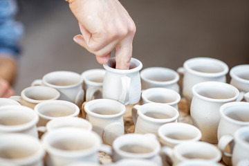 Taking clay jugs for painting