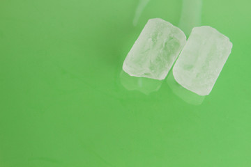 ice cubes on colorful background