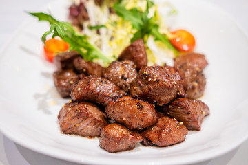 Fried sauteed beef tenderlion cubes with black pepper