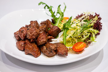 Fried sauteed beef tenderlion cubes with black pepper
