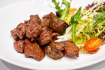 Fried sauteed beef tenderlion cubes with black pepper