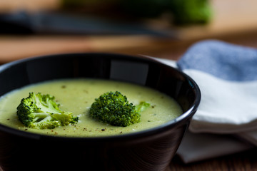 Broccoli soup in black bowl