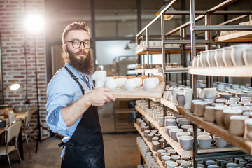 Worker at the warehouse of the pottery