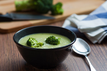 Broccoli soup in black bowl