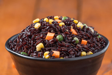 Fried rice in white plate on wood 