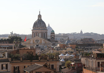 Fototapeta na wymiar many roofs and dome in Rome Italy