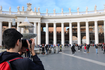 young photographer in Saint Peter Square in Vatican City