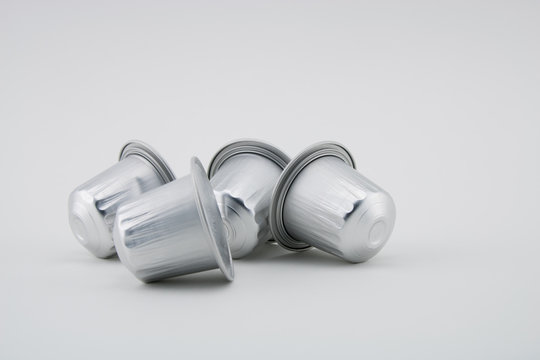 Espresso coffee capsules or coffee pods on white background. Coffee machine.