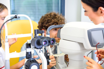 A young man getting a eye checkup at the ophthalmologist