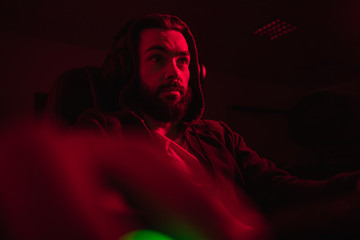 Surprised hacker in dark room